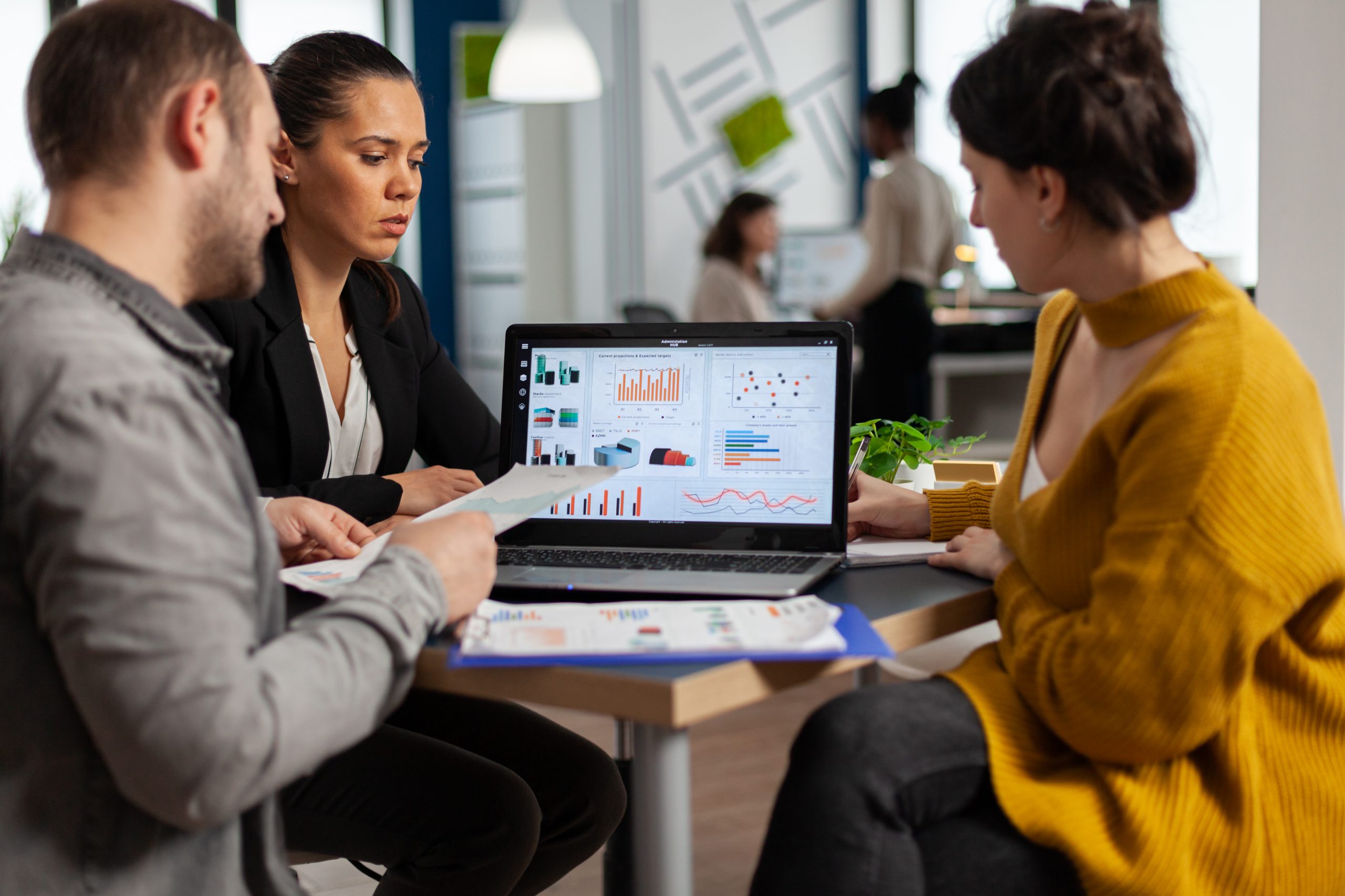 Business people talking with team leader using clipboard with documents pointing on it, presenting startup financial ideas to manager, brainstorming project management strategy in company office