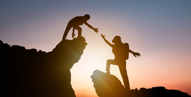 https://swiftfp.com/wp-content/uploads/2022/10/silhouette-people-helping-other-hiker-climbing-rock-mountain.jpeg