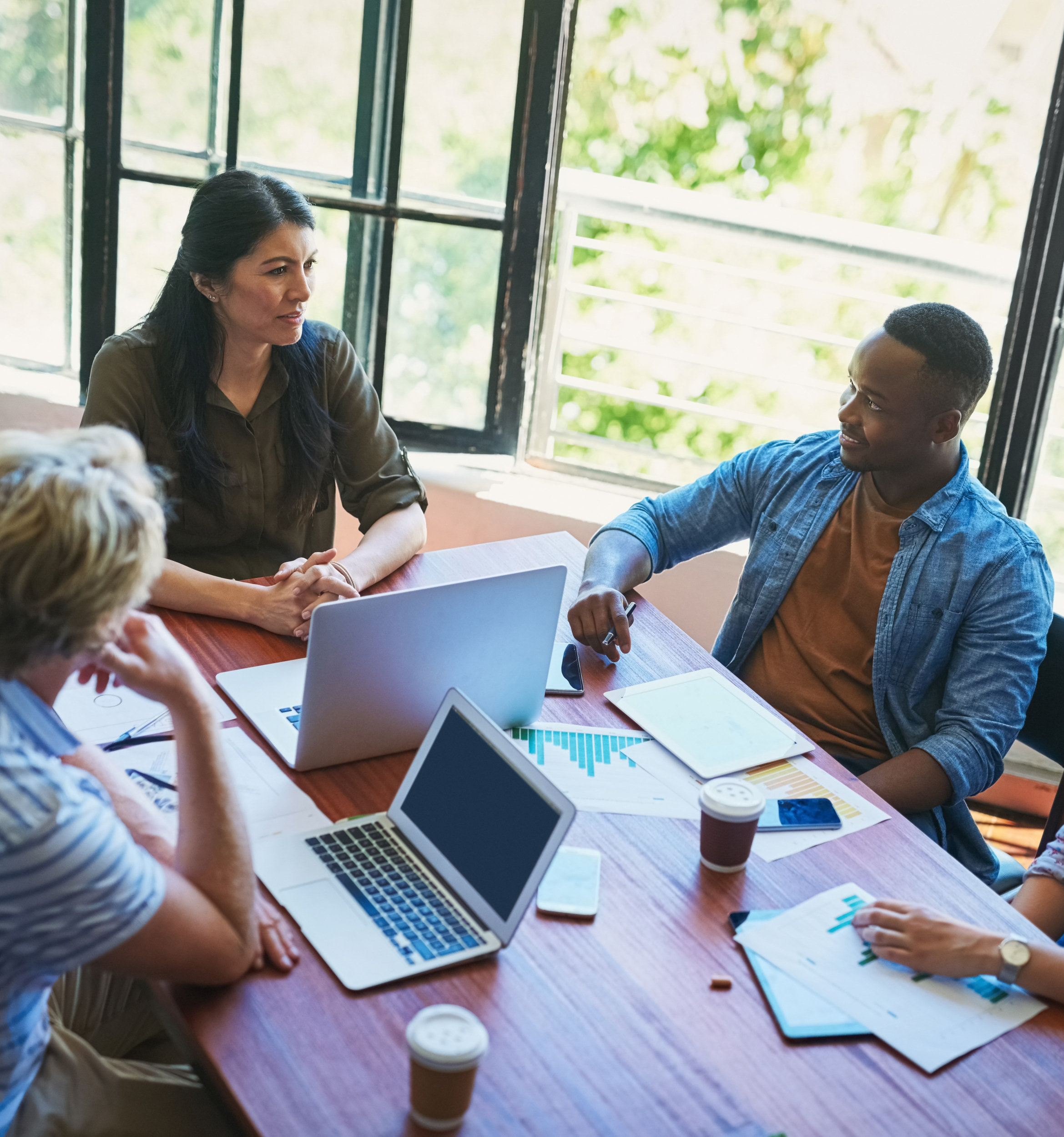 Above meeting, collaboration and business people with tech for p Above meeting, collaboration and business people with tech for planning strategy and project research with documents. Brainstorming staff, paperwork and laptop for online info in creative agency.