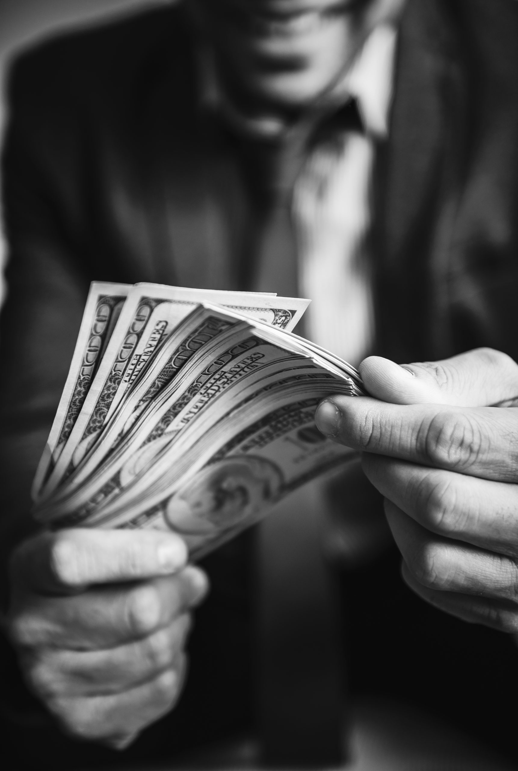 A person carrying a lot of cash A person carrying a lot of cash