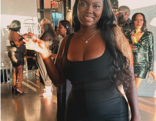 Beautiful black woman tax professional at high-class event