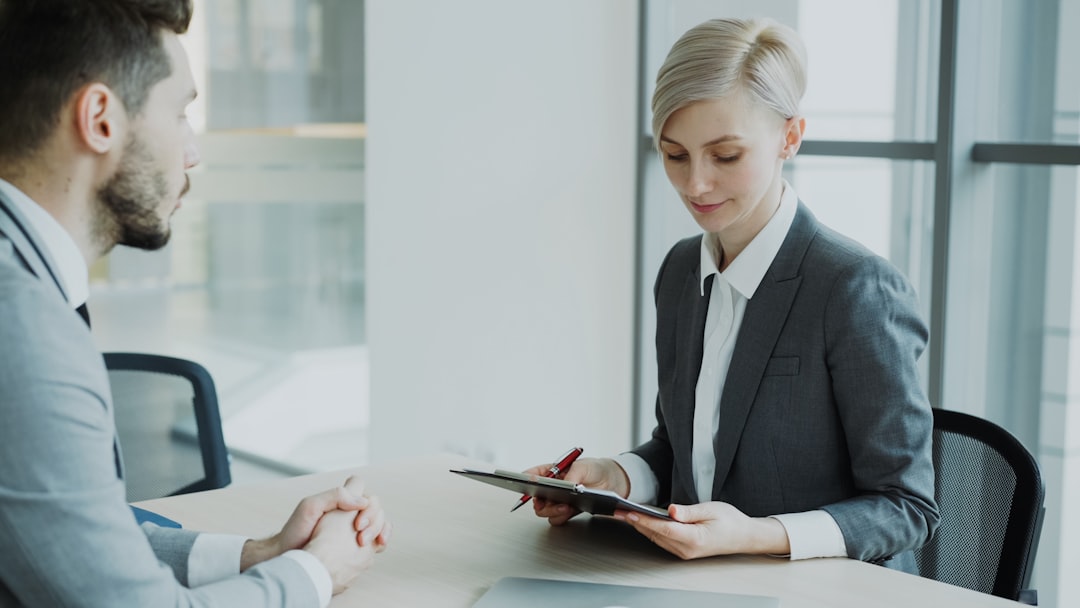 Female tax professional reviewing financial documents with a client